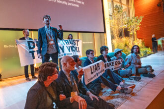 A group of activists with Climate Defiance take the stage during the New York Times’ Climate Forward event on Wednesday. Credit: Ken Schles/Climate Defiance