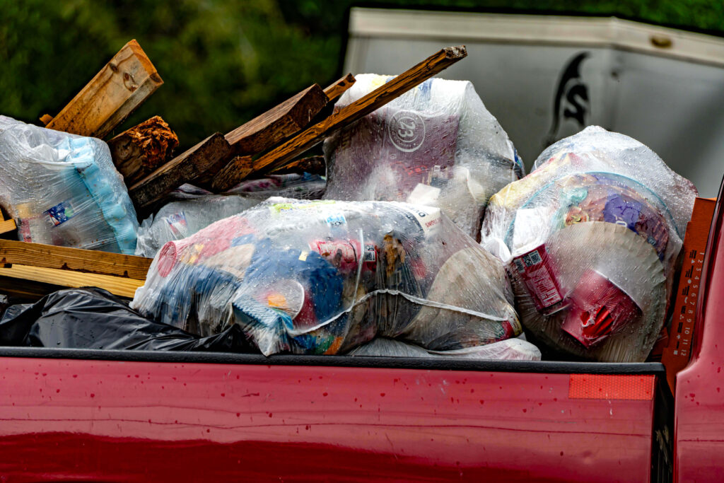 Residents without trash cans often haul off trash to nearby dumpsters or loved ones' homes. It's often not enough. Credit: Lee Hedgepeth/Inside Climate News
