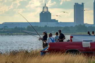Fishermen try their luck from the Mobile Bay Causeway in south Alabama. Credit: Lee Hedgepeth/Inside Climate News