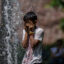 A boy cools off in a public fountain during a heat wave in New York on July 26, 2023. Credit: Angela Weiss/AFP via Getty Images
