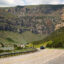 Vehicles travel on U.S. Highway 20 along the Wind River through a canyon between the towns of Shoshoni and Thermopolis in central Wyoming. Credit: Don and Melinda Crawford/UCG/Universal Images Group via Getty Images