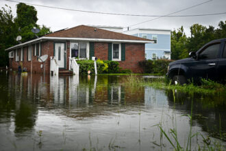 A house is surrounded by floodwaters from Tropical Storm Debby on Aug. 6 in Charleston, South Carolina. Credit: Miguel J. Rodriguez Carrillo/Getty Images