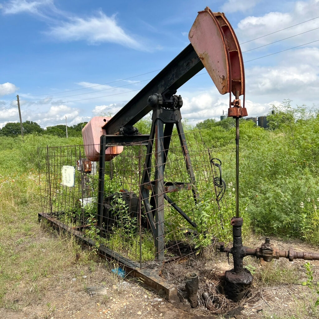 A view of an aging oil well in Caldwell County, Texas. On the ground at the left side of the pump jack is an open vent that was releasing hydrogen sulfide. Researchers measured over 300 ppm at the wellhead. Credit: Courtesy of Abigail Edgar