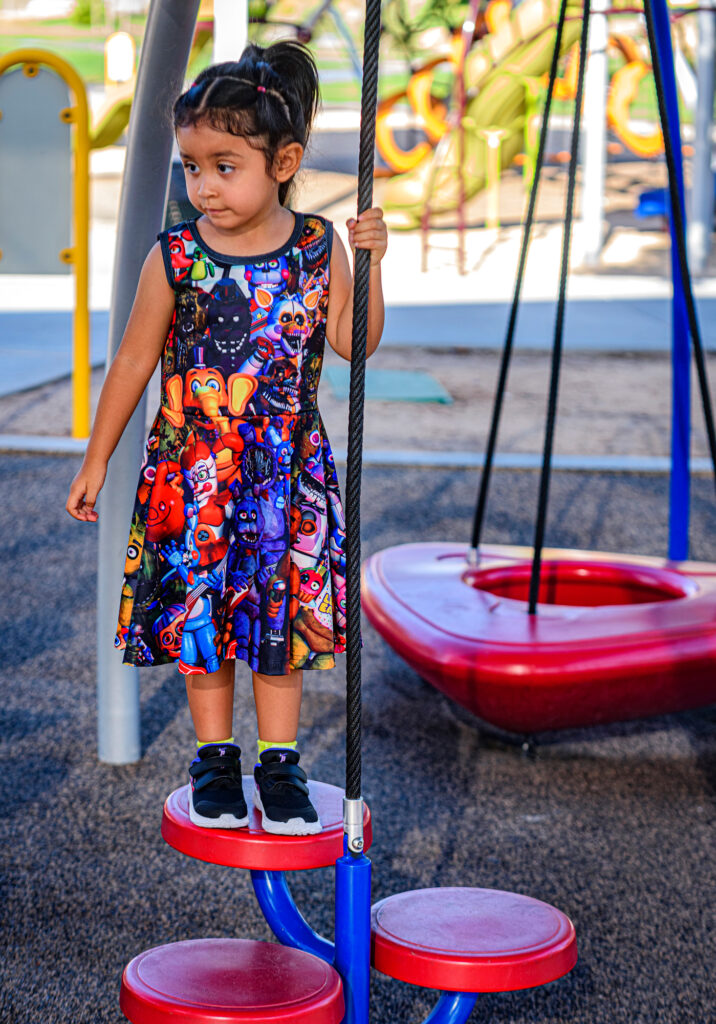 Three-year-old Layla plays on the Kiwanis Park playground in Tempe. Credit: Kevin Hurley/Inside Climate News